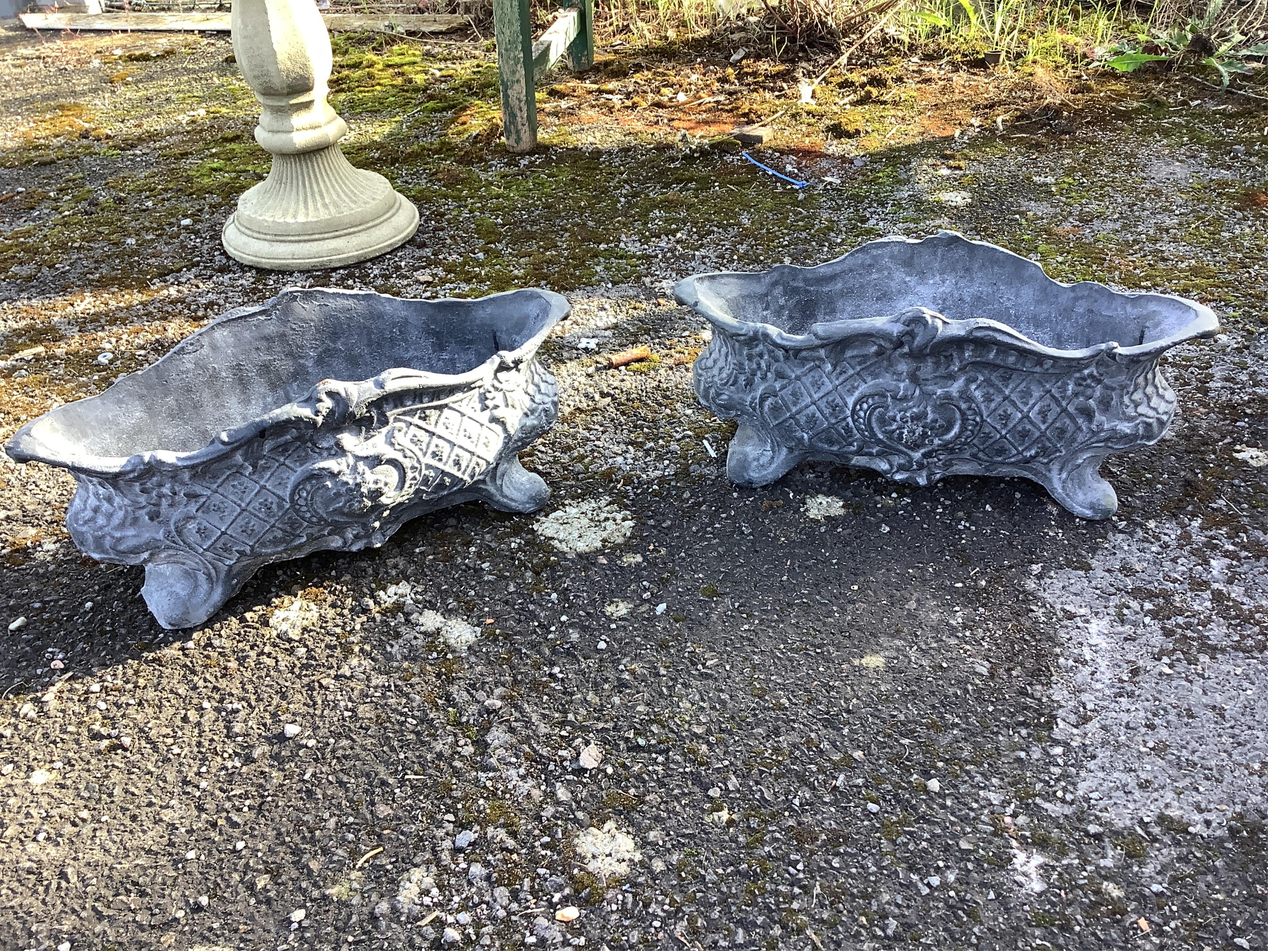 A set of four cast iron planters, width 36cm, and a pair of more ornate planters, width 48cm. Condition - weathered, otherwise good